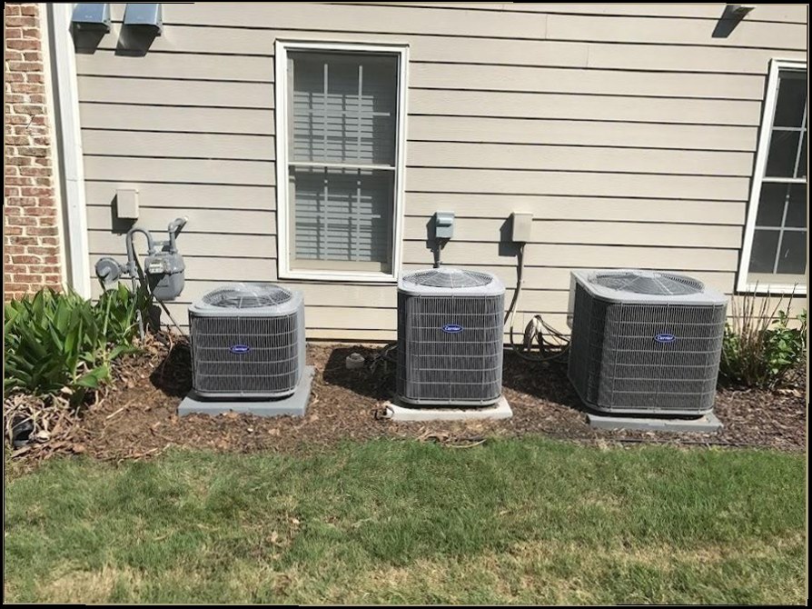 Three outdoor AC units on residential lot